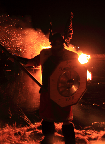 Jarl in front of burning galey