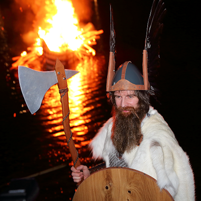 Jarl David Brown in front of his burning galley