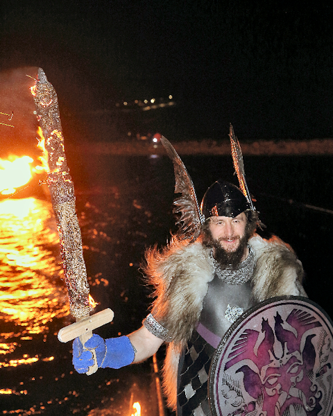 Fraser Anderson in front of his burning galley